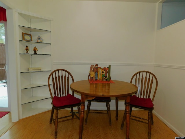 dining area with hardwood / wood-style flooring