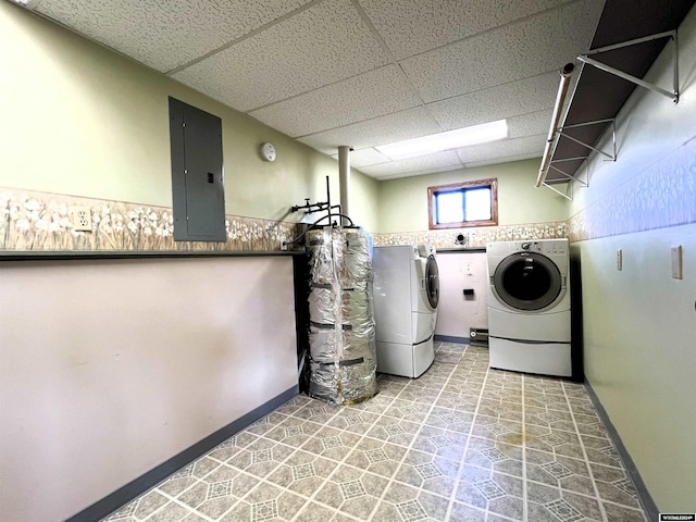 washroom with electric panel and washing machine and dryer