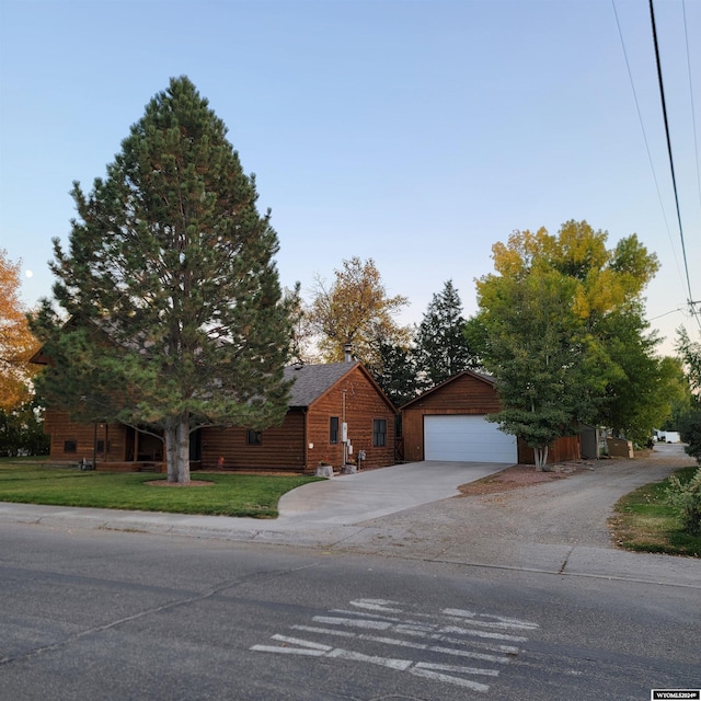 view of front of home with a garage and a front yard