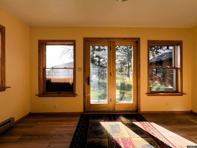 entryway featuring dark wood-type flooring and baseboard heating