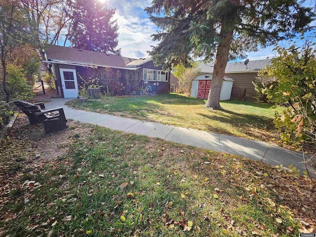 view of front of property with a storage shed and a front lawn