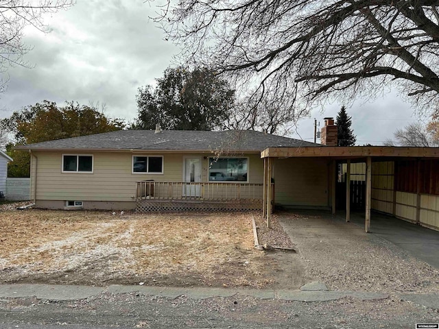 single story home with a carport