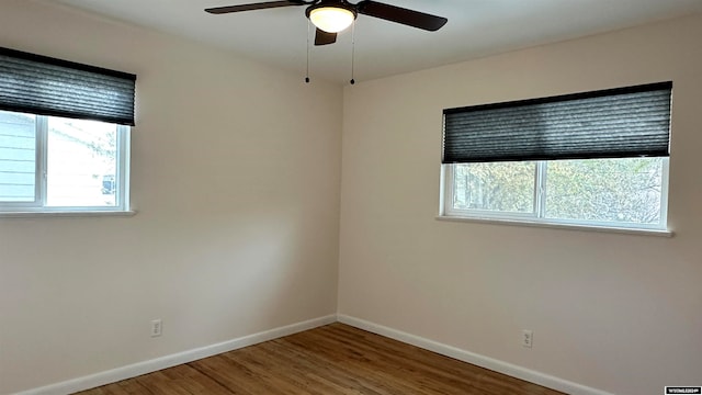 empty room with wood-type flooring and ceiling fan