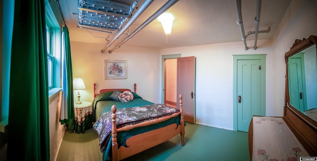 bedroom with wood-type flooring