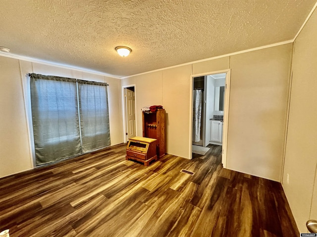 9 Sequoia Dr, Casper, WY 82604 - empty room featuring ornamental molding, wood finished floors, and a textured ceiling