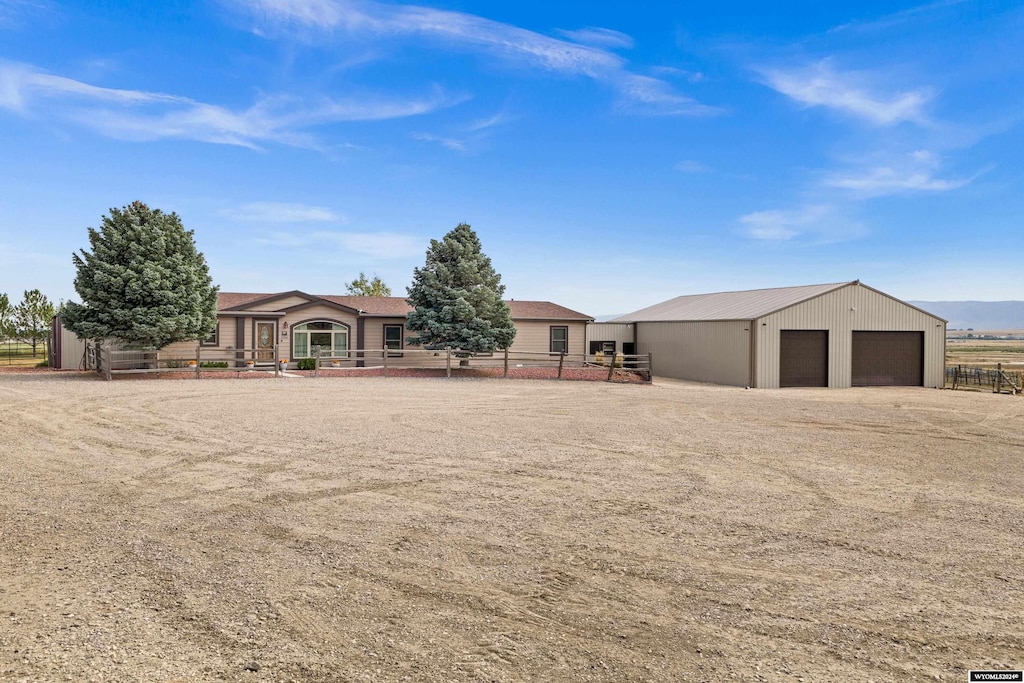 view of front of home featuring an outbuilding and a garage