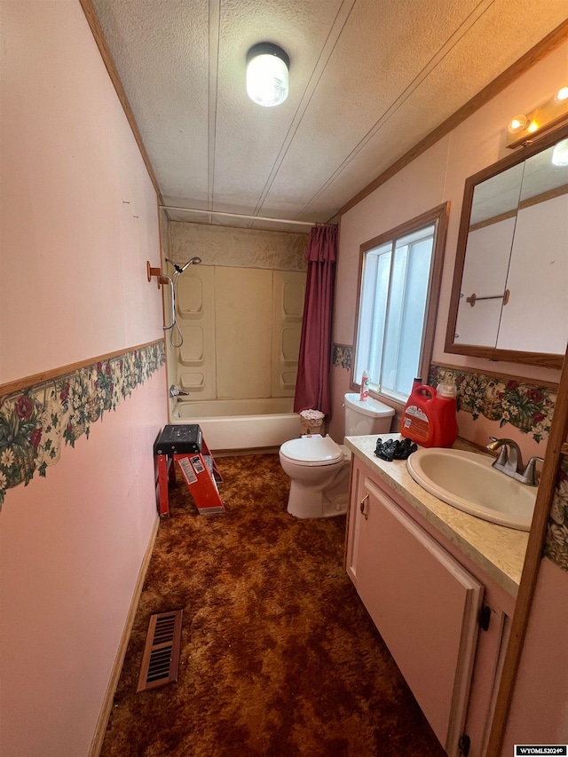 full bathroom with vanity, shower / bath combo with shower curtain, a textured ceiling, and toilet