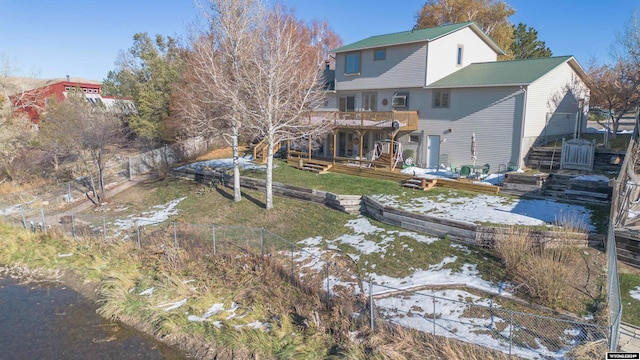 rear view of house with a lawn