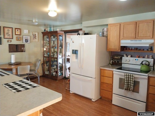 kitchen featuring white appliances and light wood-type flooring