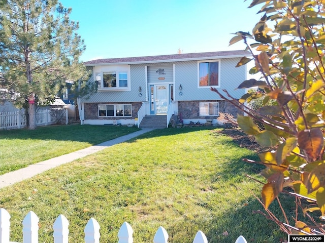 raised ranch featuring a front yard