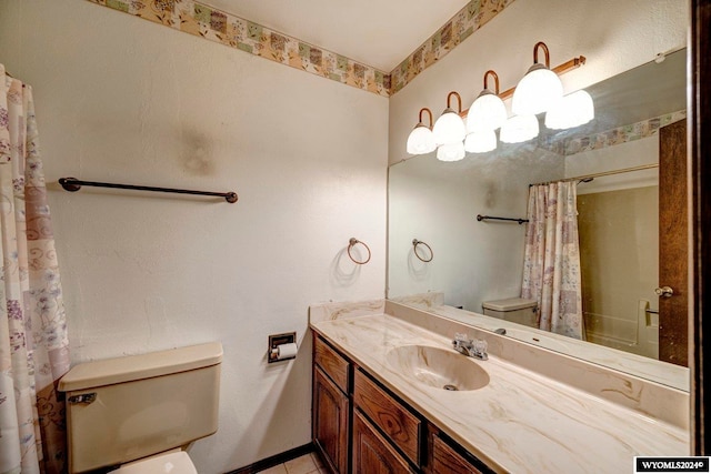 bathroom with toilet and vanity