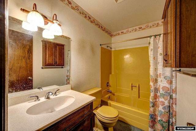 full bathroom with vanity, shower / bath combination with curtain, and toilet