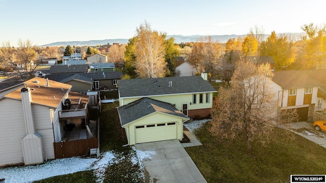 birds eye view of property with a mountain view