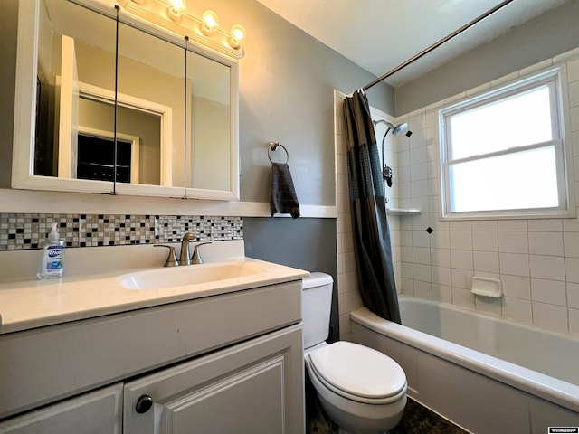 full bathroom featuring decorative backsplash, vanity, shower / bath combo with shower curtain, and toilet