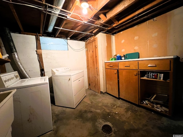 clothes washing area featuring washing machine and clothes dryer