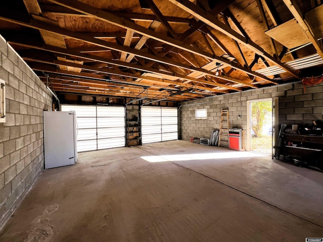 garage with white refrigerator