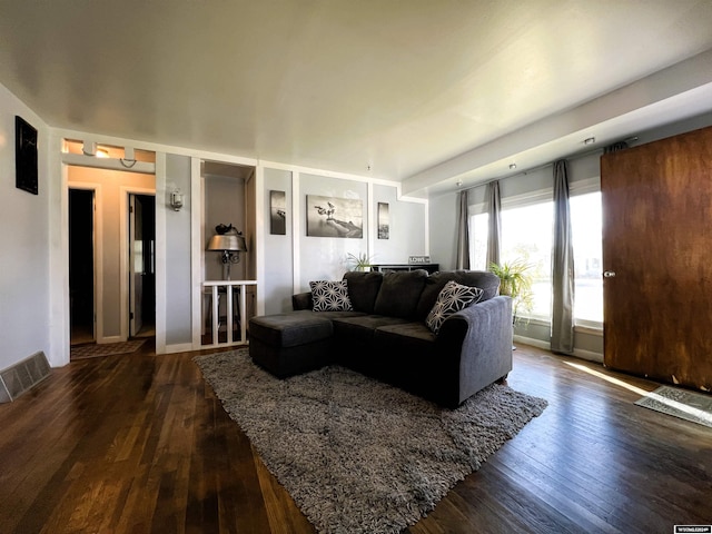 living room with dark wood-type flooring