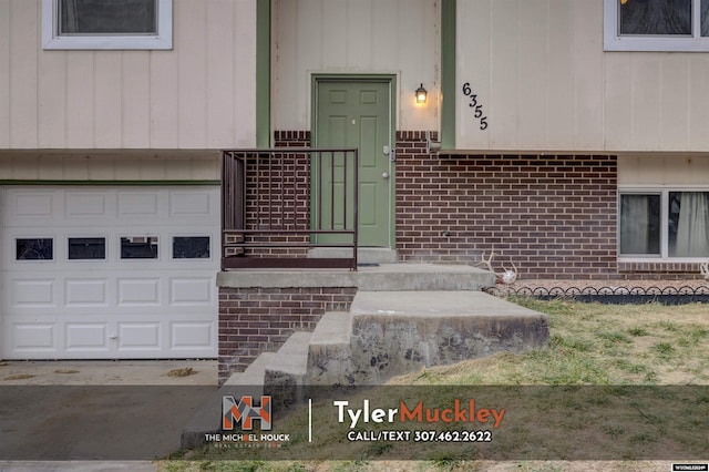 doorway to property featuring a garage