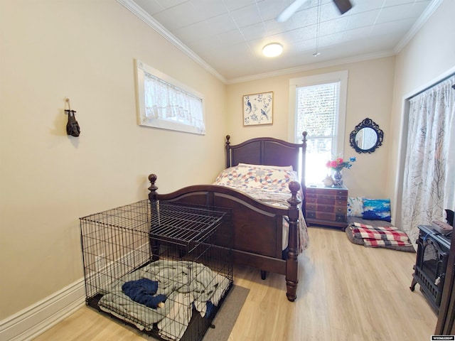 bedroom with hardwood / wood-style flooring and ornamental molding