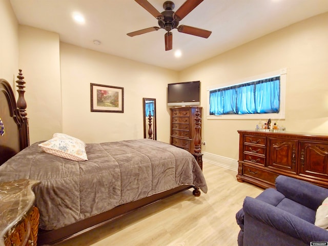 bedroom with light wood-type flooring and ceiling fan