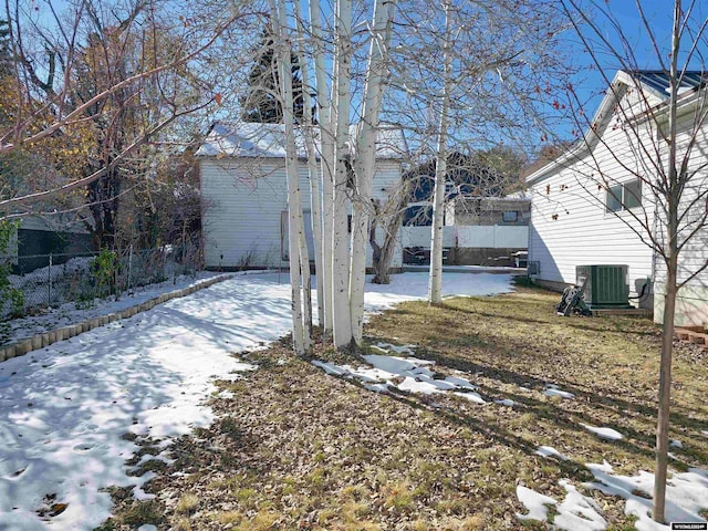 snowy yard with central air condition unit