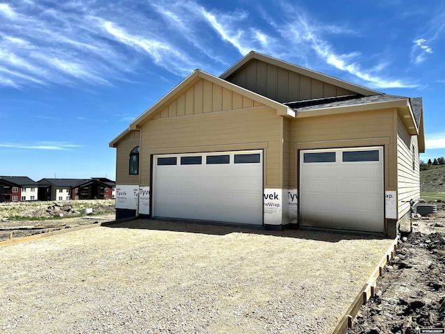 4921 Tranquility Way, Casper, WY 82601 - garage featuring gravel driveway