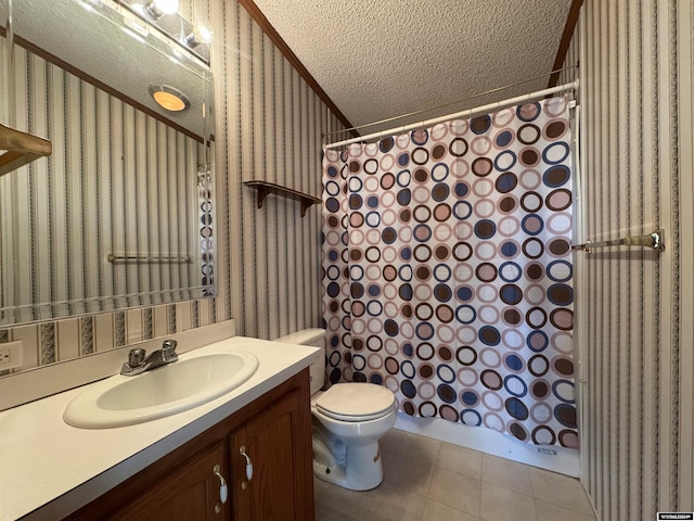 bathroom featuring tile patterned floors, vanity, a textured ceiling, crown molding, and toilet