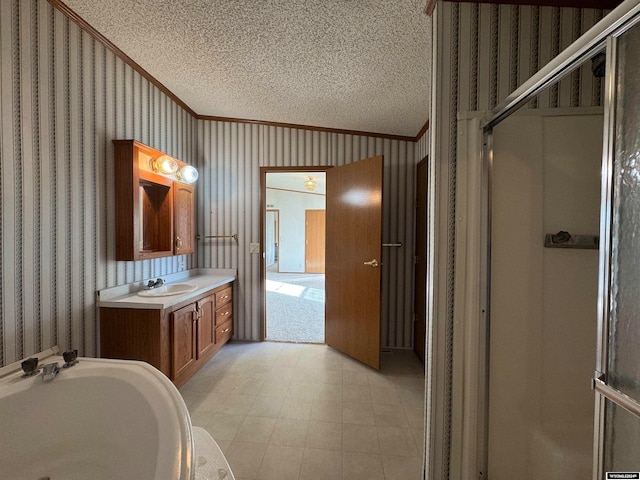 bathroom featuring lofted ceiling, a shower with shower door, a textured ceiling, and ornamental molding