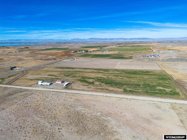 birds eye view of property featuring a mountain view and a rural view