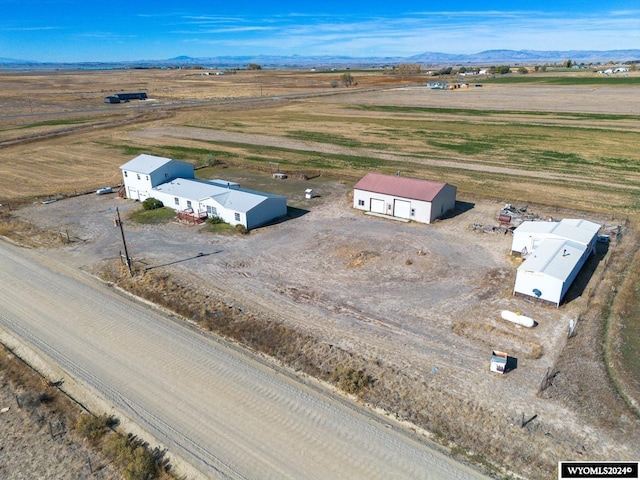 aerial view with a mountain view and a rural view