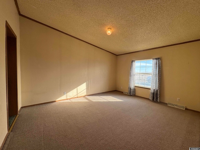 carpeted spare room with a textured ceiling and ornamental molding