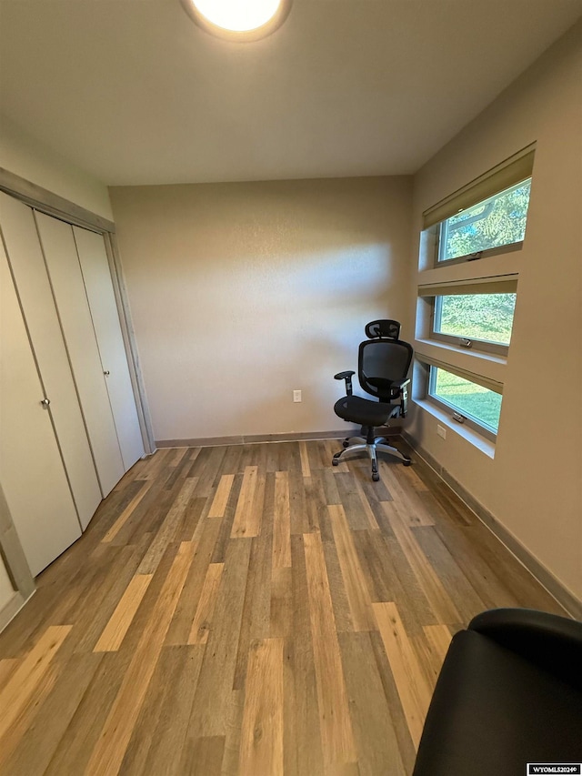 unfurnished office with light hardwood / wood-style floors