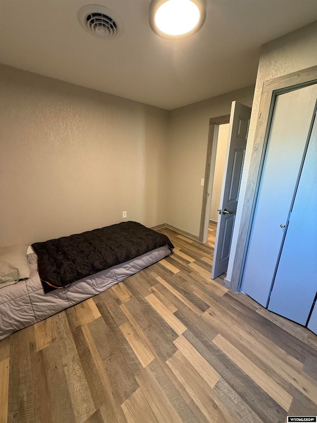 unfurnished bedroom featuring light hardwood / wood-style flooring