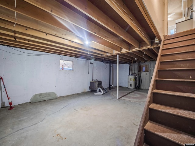 basement with stairs and water heater