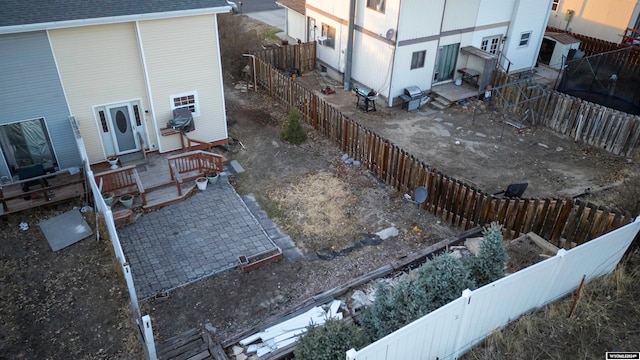 view of yard with a fenced backyard and entry steps