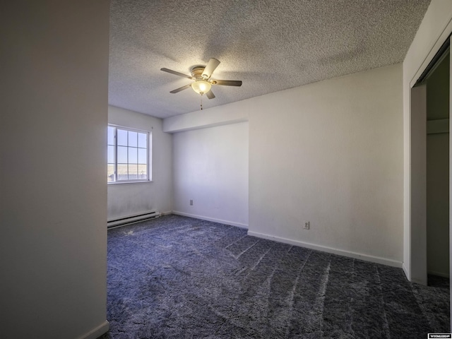909 Skyline Dr, Douglas, WY 82633 - unfurnished bedroom with a baseboard heating unit, a textured ceiling, dark colored carpet, ceiling fan, and baseboards