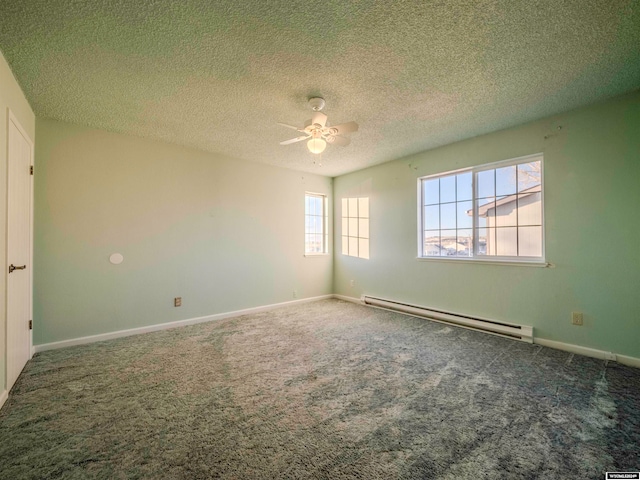 empty room with a baseboard heating unit, baseboards, carpet floors, a textured ceiling, and a ceiling fan