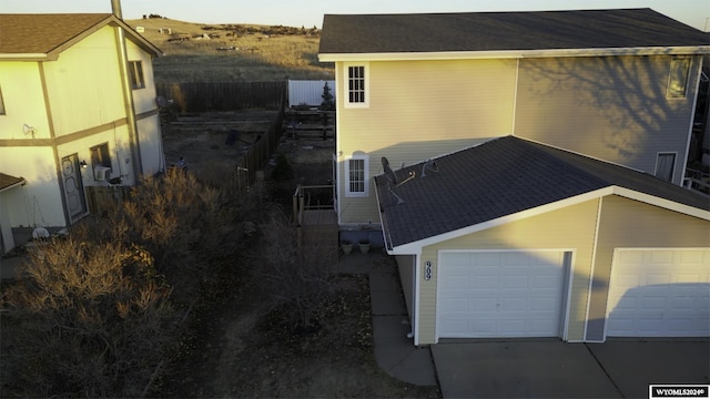 909 Skyline Dr, Douglas, WY 82633 - view of property exterior with a garage and concrete driveway