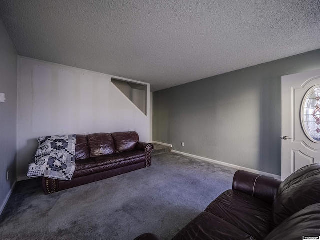 909 Skyline Dr, Douglas, WY 82633 - carpeted living area with a textured ceiling and baseboards