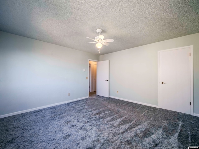 unfurnished bedroom featuring carpet flooring, a textured ceiling, baseboards, and a ceiling fan