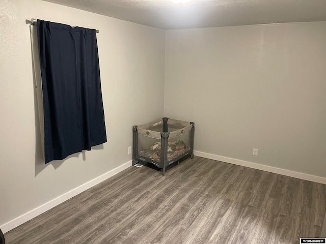 unfurnished room featuring dark hardwood / wood-style floors