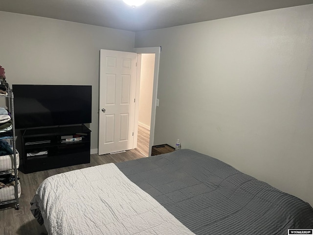 bedroom featuring dark hardwood / wood-style floors