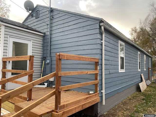 view of side of property featuring a deck