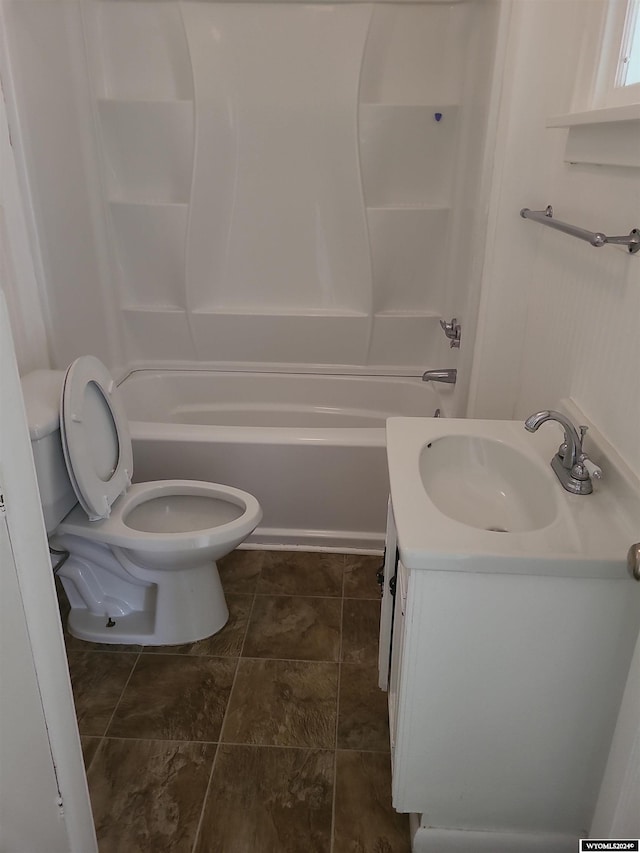 full bathroom featuring vanity, bathing tub / shower combination, and toilet