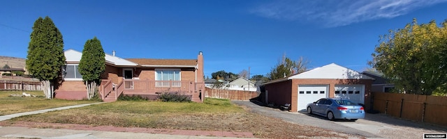 view of front facade with a front yard and a garage