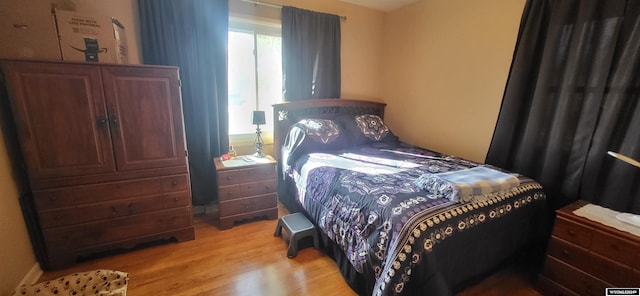 bedroom with light hardwood / wood-style flooring