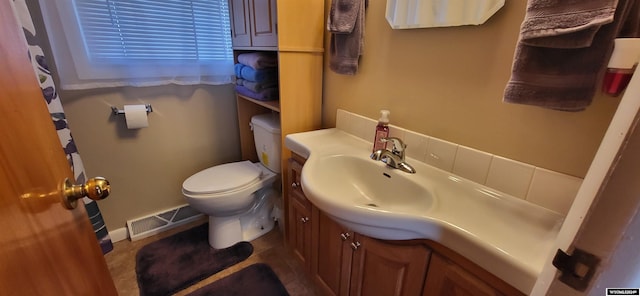 bathroom with vanity and toilet