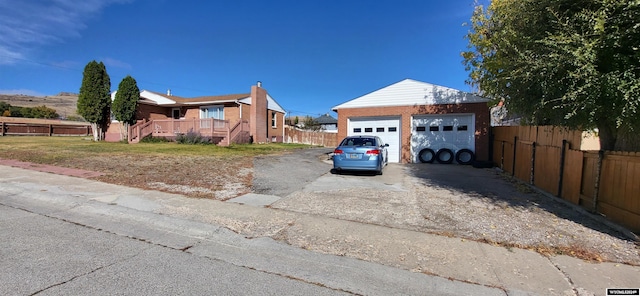 view of front of home with an outbuilding and a garage