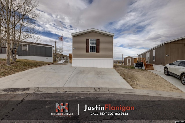 view of home's exterior featuring a storage shed