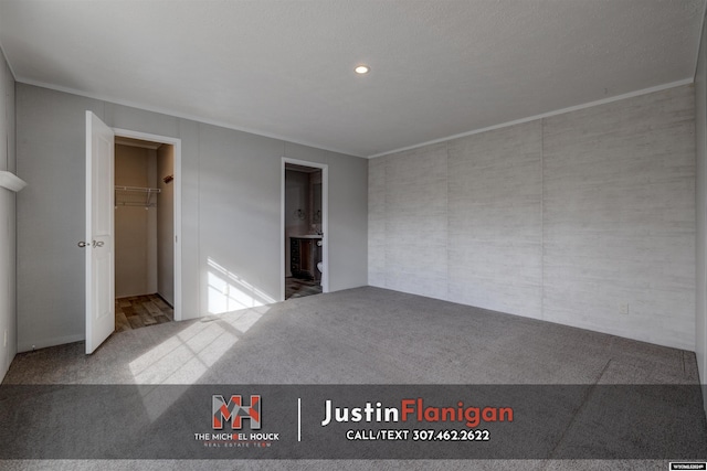 carpeted empty room featuring ornamental molding